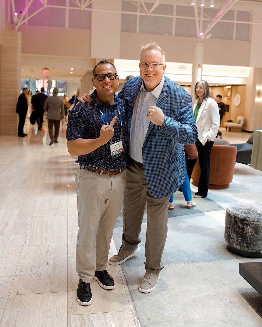 Two FirstHome IQ partners celebrating together at an industry event